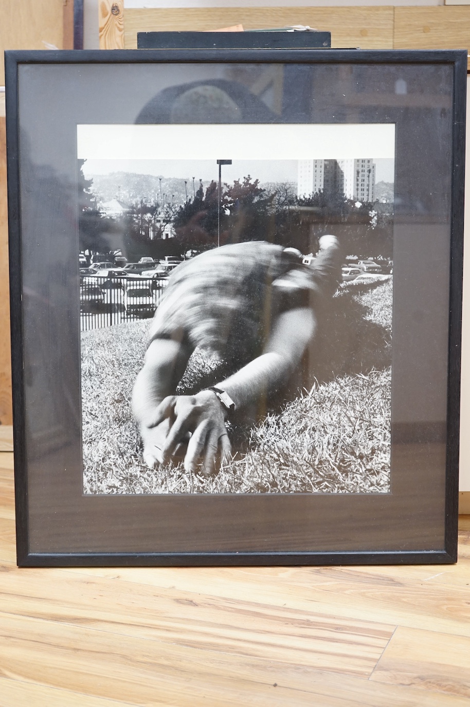 Hope Sandrow, photograph, man rolling on lawn, with typed Gracie Mansion Gallery label to the rear, reading; Gracie Mansion Gallery, 167 Avenue A, New York City, New York, 10009, HOPE SANDROW, Untitled, Silverprint 1983,